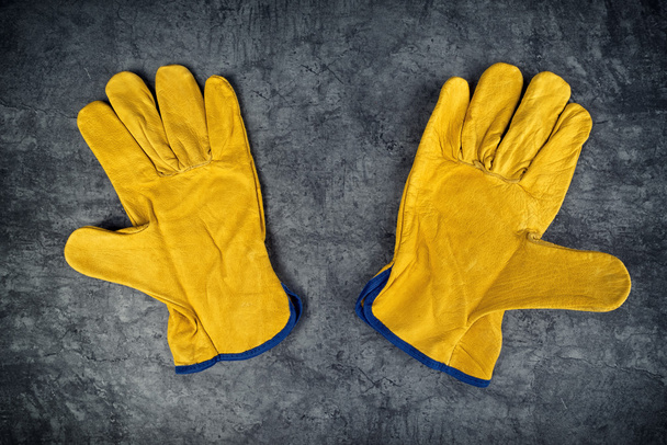 Pair of Yellow Leather Construction Work Gloves - Fotó, kép
