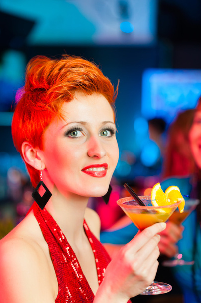 People in club or bar drinking cocktails - Fotó, kép