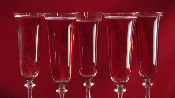 Sparkling rose wine in five glasses - Footage, Video