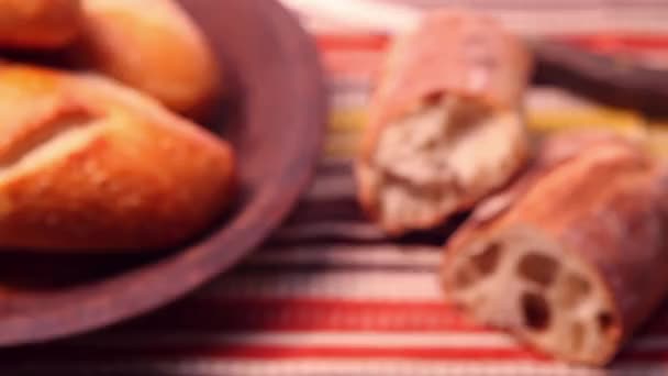 Ciabatta next to a breadbasket with a bread roll - Footage, Video
