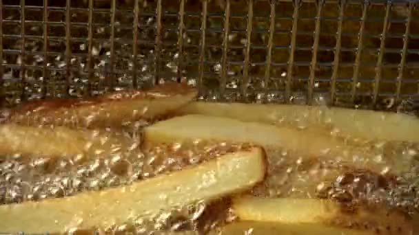 Deep-frying chips in a basket - Footage, Video