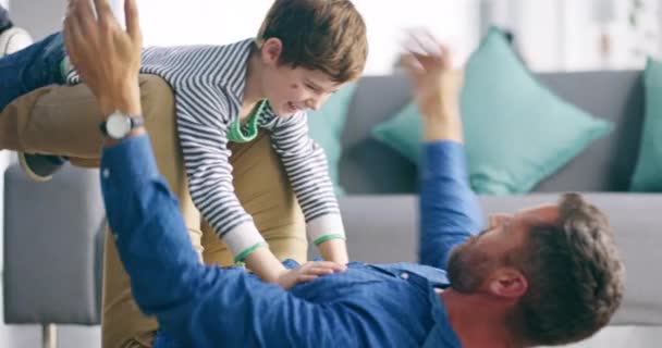 Relax, playing and father with child in living room for bonding, relax and having fun together. Family, home and happy dad with son air for airplane games in home for love, care or happiness on floor. - Footage, Video