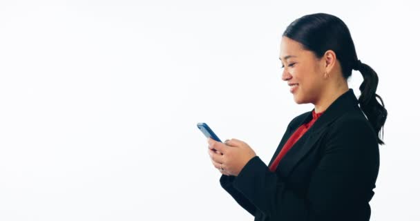 Business woman, phone and typing in studio for social network, mobile chat and corporate contact on mockup space. Happy asian worker scroll on smartphone, news app or search media on white background. - Footage, Video