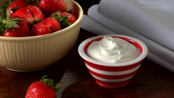 Dipping a strawberry in yoghurt - Footage, Video