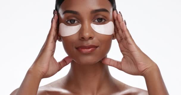 Eye mask, skincare wellness and woman face with beauty, dermatology and collagen treatment. Studio, white background and female person portrait with cosmetics and facial for anti aging and skin glow. - Footage, Video