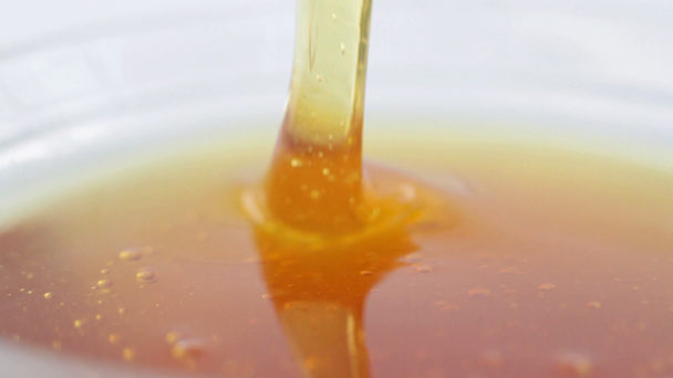 Honey with honey dipper - Imágenes, Vídeo