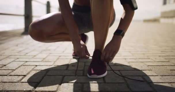Feet, hands and tie shoelace, running outdoor for fitness with person ready for exercise. Sneakers, start run and workout with race or marathon, health and wellness with athlete and sports in nature. - Footage, Video