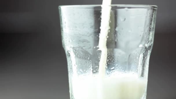 Pouring strawberry milk into a glass - Filmagem, Vídeo