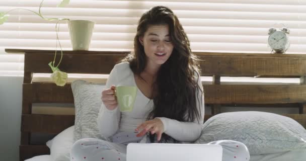 Video call, laptop or woman in bed talking online for live streaming or social networking at home. Coffee, morning or female person speaking in conversation or virtual communication on technology. - Footage, Video