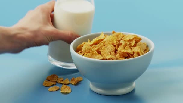 Pouring milk over cornflakes - Footage, Video