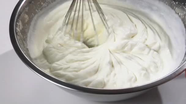 Whipping cream using an electric whisk - Footage, Video