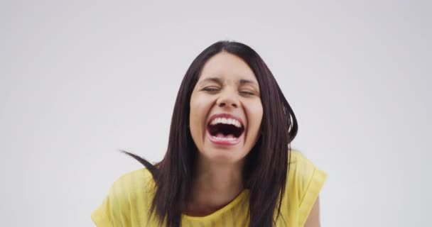 Woman, comedy and laugh in studio for humor, funny meme or carefree personality on mock up space. Person, lady and laughing with joke, confidence and positive expression on white background for fun. - Footage, Video