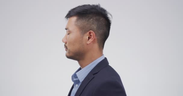 Face, cry and sad with an asian man in studio on a white background feeling the emotion of pain or grief. Portrait, mental health and depression with a business man unhappy at the financial crisis. - Footage, Video