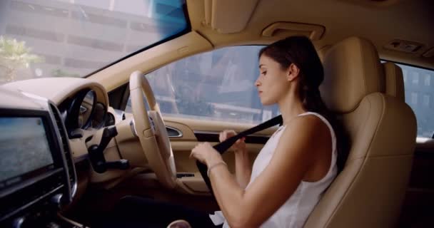 Business woman, car seatbelt and driving with safety on journey, transport and road trip in city. Person, driver and thinking to start vehicle for travel on metro street, urban highway and traffic. - Footage, Video