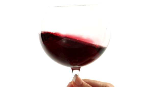 Vířící červené víno ve skle - Záběry, video