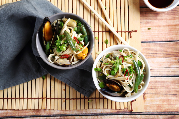 soy noodles with mussels in a bowl - Photo, image
