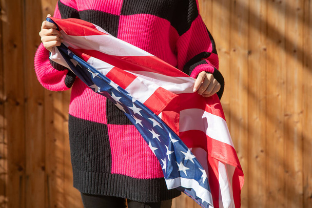 Caucasian young woman with a Us flag. - Photo, Image