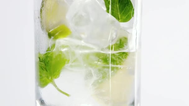Glass water with mint leaves and lime - Footage, Video