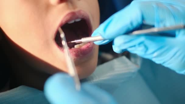 dentist examining boy's teeth with  dentistry tools  - Footage, Video