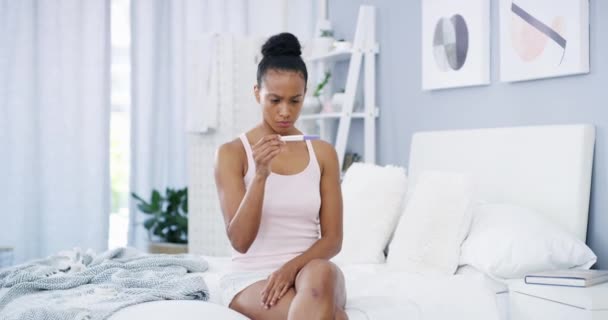 Woman, pregnancy test and stress at home or anxiety, bedroom and future for healthcare. Black female person, fail contraception and mistake for positive maternity kit, fear or nervous thinking. - Felvétel, videó