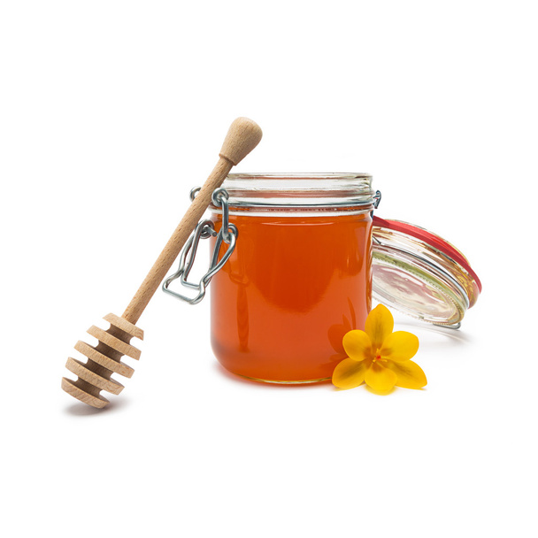pot de miel de fleur avec bâton de bois sur blanc
 - Photo, image