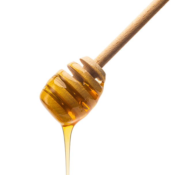 Honey dipper with golden honey - Foto, Imagen