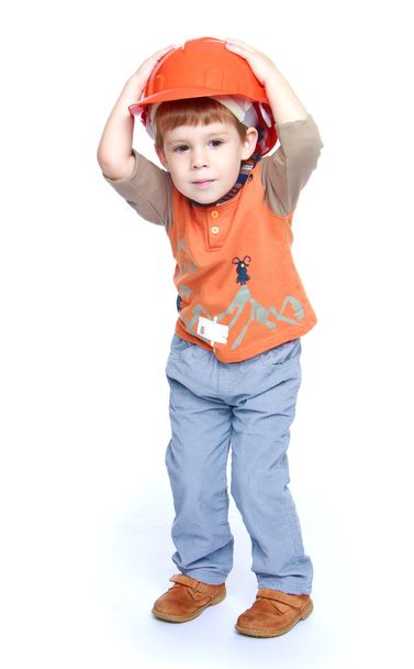 The little boy in the construction helmet. - Valokuva, kuva