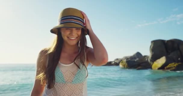 Beach, walking and young woman with a smile on adventure, vacation or weekend trip for tropical summer. Happy, travel and female person from Australia having fun by the ocean or sea on a holiday - Footage, Video