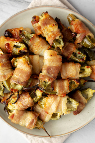 Homemade Bacon-Wrapped Jalapeno Poppers on a Plate, top view. Close-up. - Photo, Image