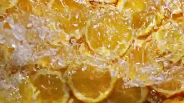 slow motion drop water of orange background. - Footage, Video