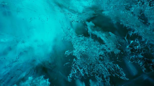 Majestic ice rocks in vatnajokull caves, transparent blue blocks of ice melting after global warming in iceland. Climate change affecting icelandic glaciers and polar nature. Handheld shot. - Photo, Image