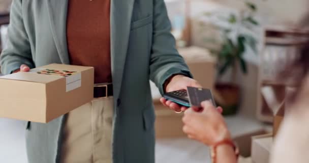Hands, credit card and payment for box with pos, machine and shipping with easy tap at warehouse. People, fintech and cardboard package at workshop, store or shop for logistics, distribution or sales. - Footage, Video