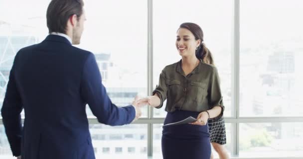 Business people, shaking hands and job interview, Human Resources meeting or career introduction in lobby. Happy woman or clients handshake with documents, resume and talking of recruitment or hiring. - Footage, Video