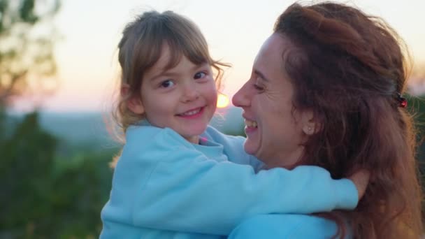 Happy cute affectionate adopted little kid girl hugging foster care parent mother with eyes closed, adorable small child daughter embrace mum cuddling enjoy tender sweet moment concept, close up view. - Footage, Video