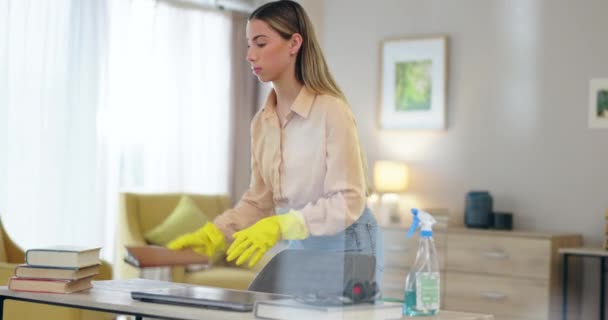 Woman, cleaning and organize desk with service, housekeeping and disinfecting furniture with chemical detergent. Cleaner, hygiene and rearrange office supplies, house work with spray and maintenance. - Footage, Video