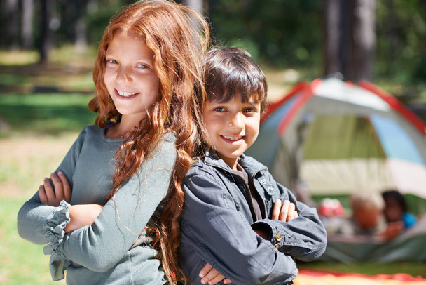 Arms crossed, kids camping or portrait of friends in nature for playing, adventure or holiday vacation in park. Happy, relax or children with smile in woods, garden or forest for fun hiking or travel. - Photo, Image