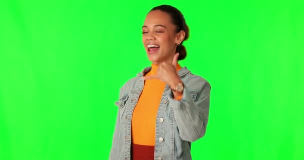 Call me, green screen and a happy young woman flirting on a studio background. Portrait of gen z student person with hand sign for contact us announcement, communication or talking emoji with hands. - Footage, Video