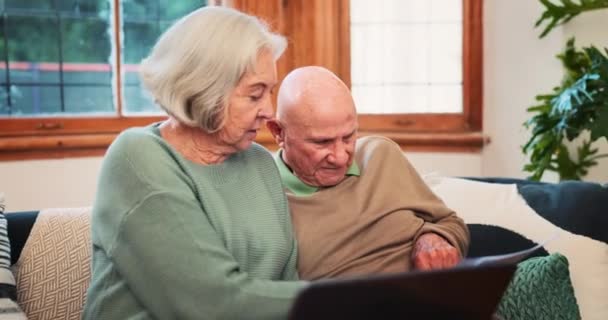 Senior couple, laptop and documents in home for budget, planning investment portfolio or financial assets. Old man, woman and reading banking report of account, retirement savings or insurance policy. - Footage, Video