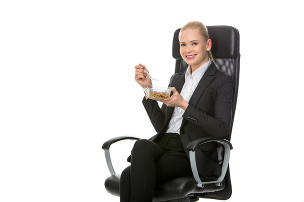 Businesswoman having lunch - Photo, Image
