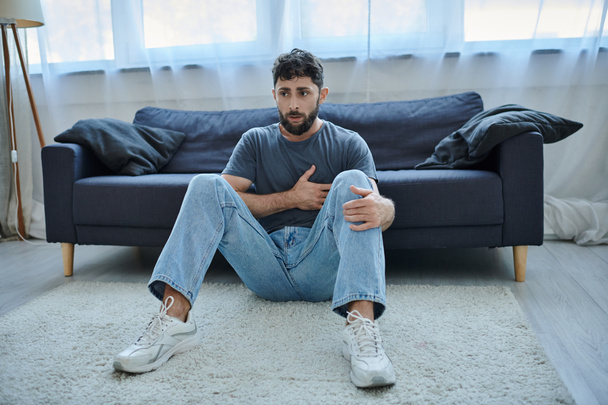 bearded suffering man in casual home wear having severe panic attack, mental health awareness - Photo, Image