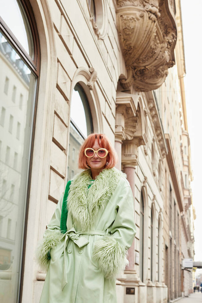 street fashion, woman traveler in trendy sunglasses walking on urban street in Vienna, Austria - Photo, Image