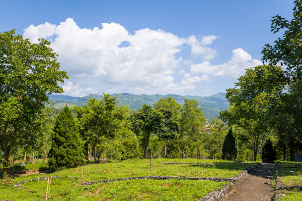This landscape photo was taken, in Asia, in Vietnam, in Tonkin, in Dien Bien Phu, in summer. We see the gardens around the Victory Monument, under the Sun. - Photo, Image
