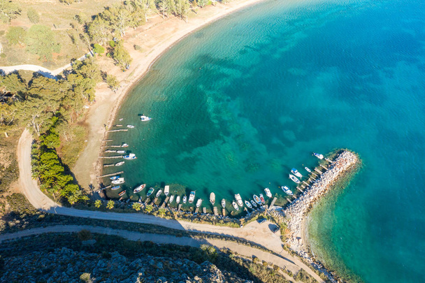This landscape photo was taken, in Europe, in Greece, in the Peloponnese, in Argolis, in Nafplio, at the seaside of Myrto, in summer. We see the port of the beach of Paralia karathona on the arid coast, under the sun. - Photo, Image