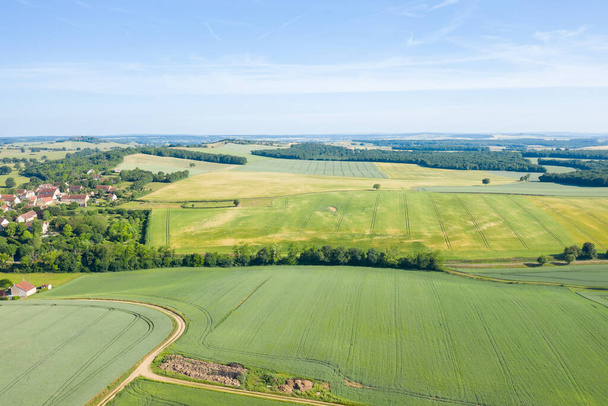 This landscape photo was taken in Europe, in France, in Burgundy, in Nievre, in Cuncy les Varzy, towards Clamecy, in summer. We see the forests and the fields of the countryside, under the Sun. - Photo, Image