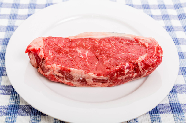 Raw Strip Steak on White Plate - Fotografie, Obrázek