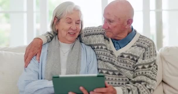 Home, hug and senior couple with tablet, typing and connection with social media, conversation and lens flare. Apartment, elderly man and old woman with technology, mobile user and network with app. - Footage, Video
