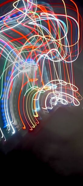 Light trails in Lineage. Art image. Long exposure photo taken in a Lineage. Blue and red light painting photography, long exposure fairy blue and red lights curves and waves against a black background. Long exposure light painting photography. Abs - Photo, Image