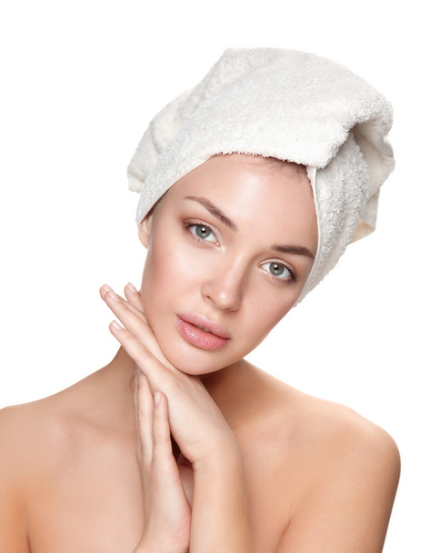 Portrait of beautiful girl touching her face with a towel on  head - Photo, image