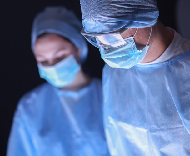 Team surgeon at work in operating room. - Foto, Bild