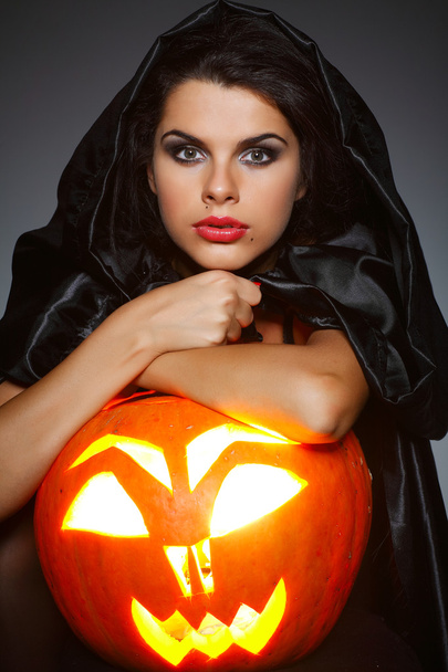 Sexual brunette in the suit of witch in night of Halloween - Foto, imagen